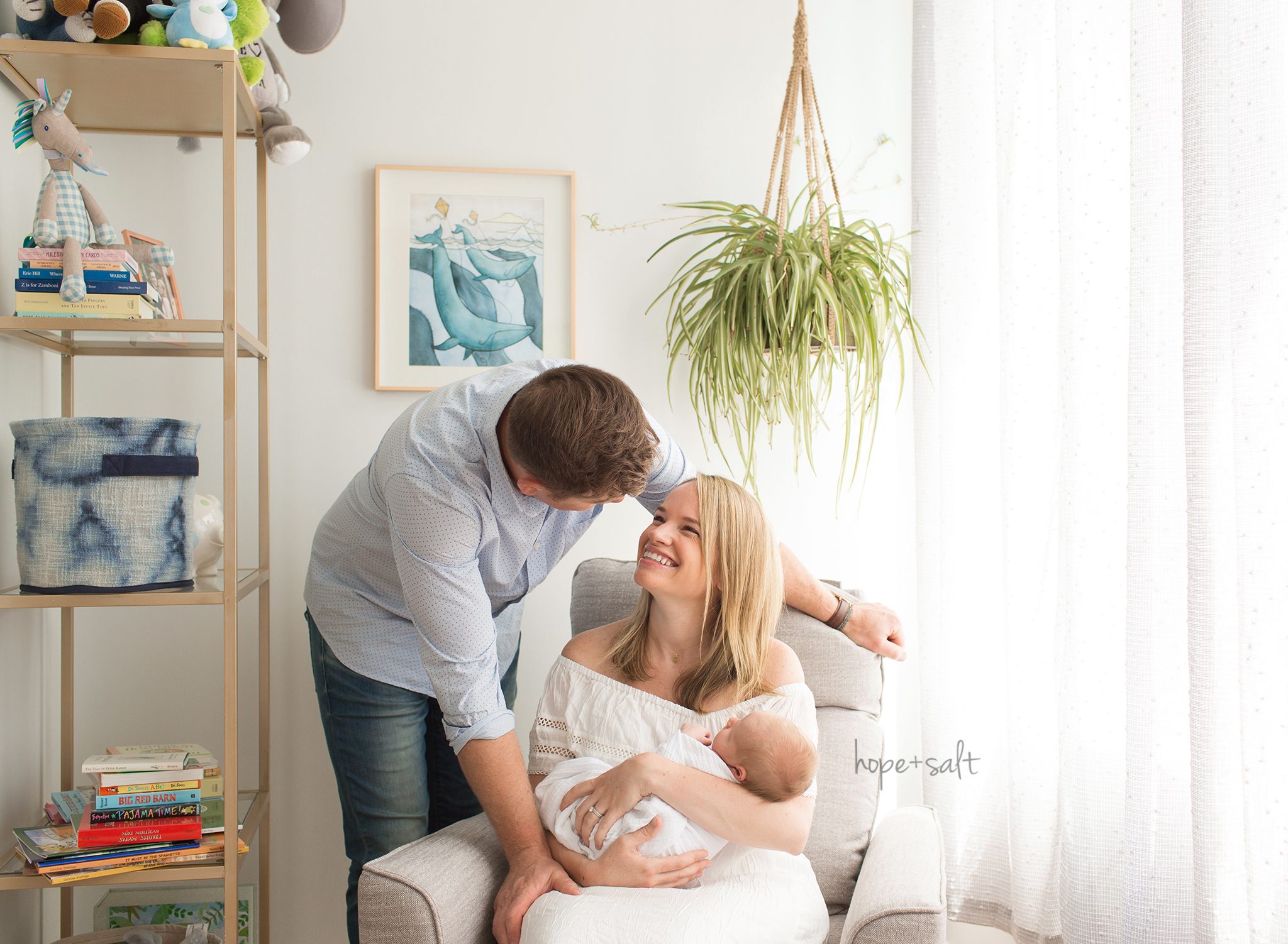 burlington newborn photographer - baby max in home lifestyle session with family of three in rocking chair