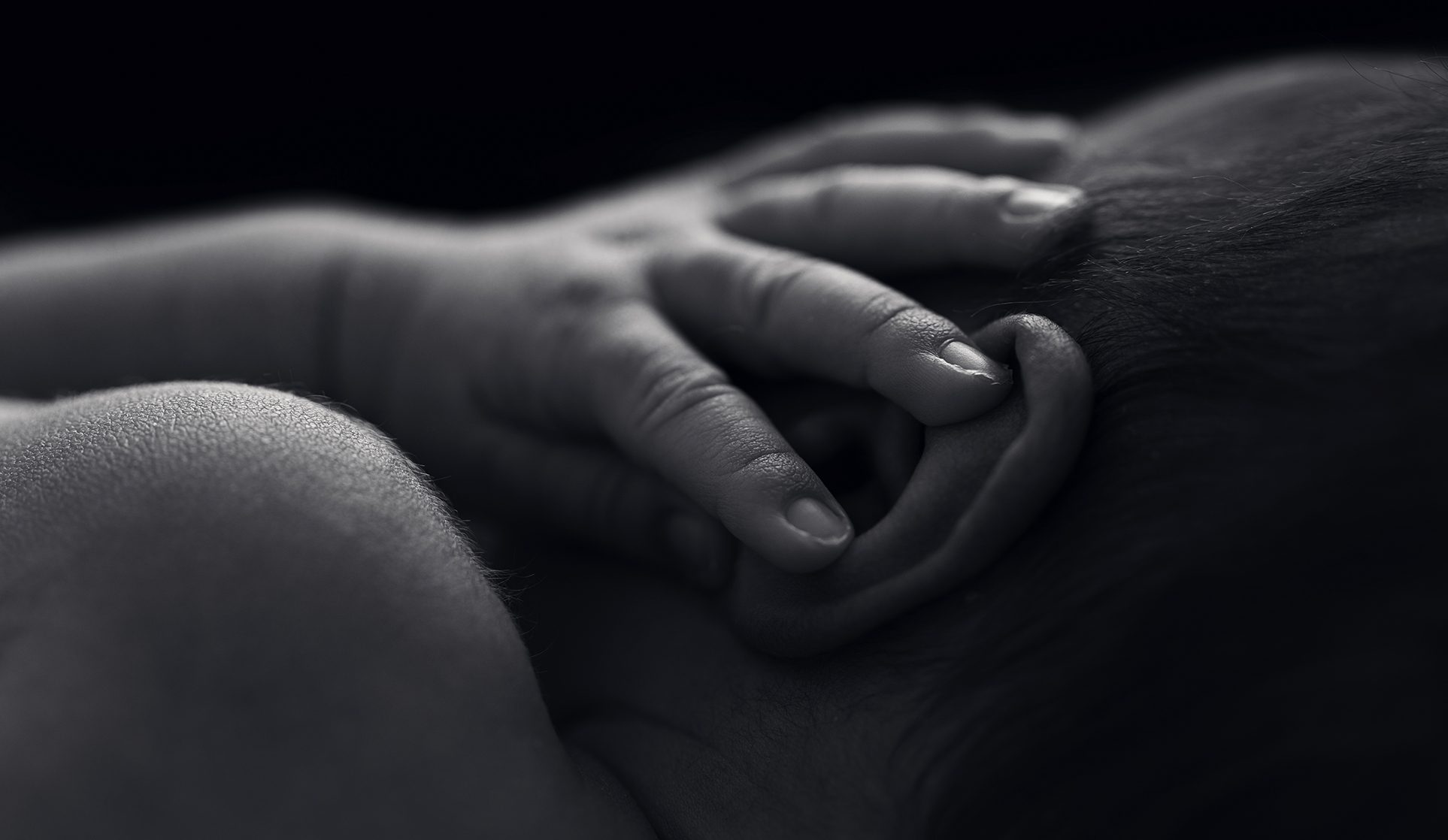 macro detail newborn skin peach fuzz and hand by burlington newborn photographer hope and salt