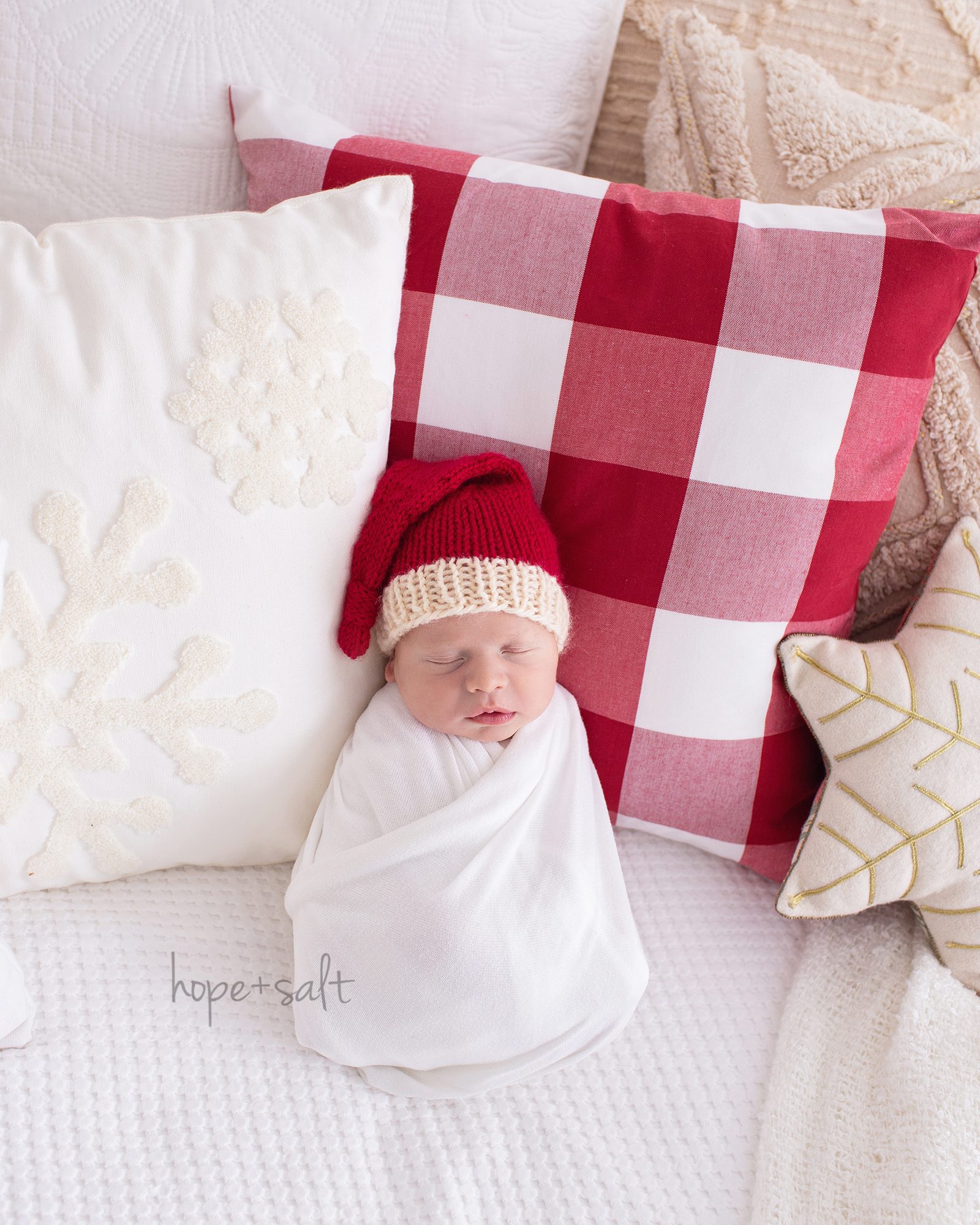 christmas newborn image of baby boy in studio session by hope and salt